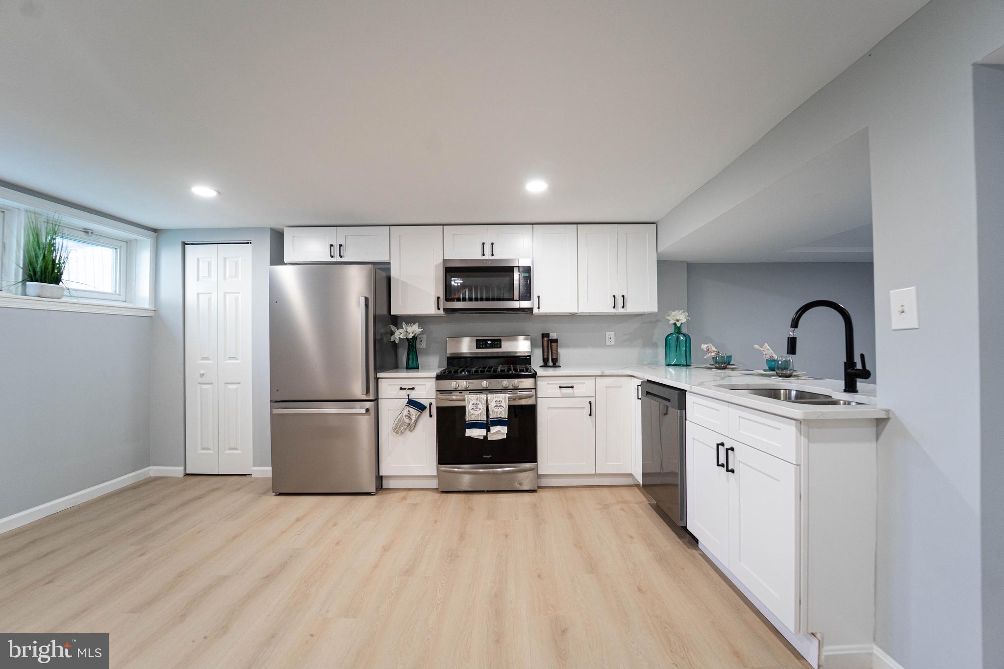 2841 Federal Street Baltimore, MD 21213 - Photo 16 of 39 a kitchen with a refrigerator sink and stove