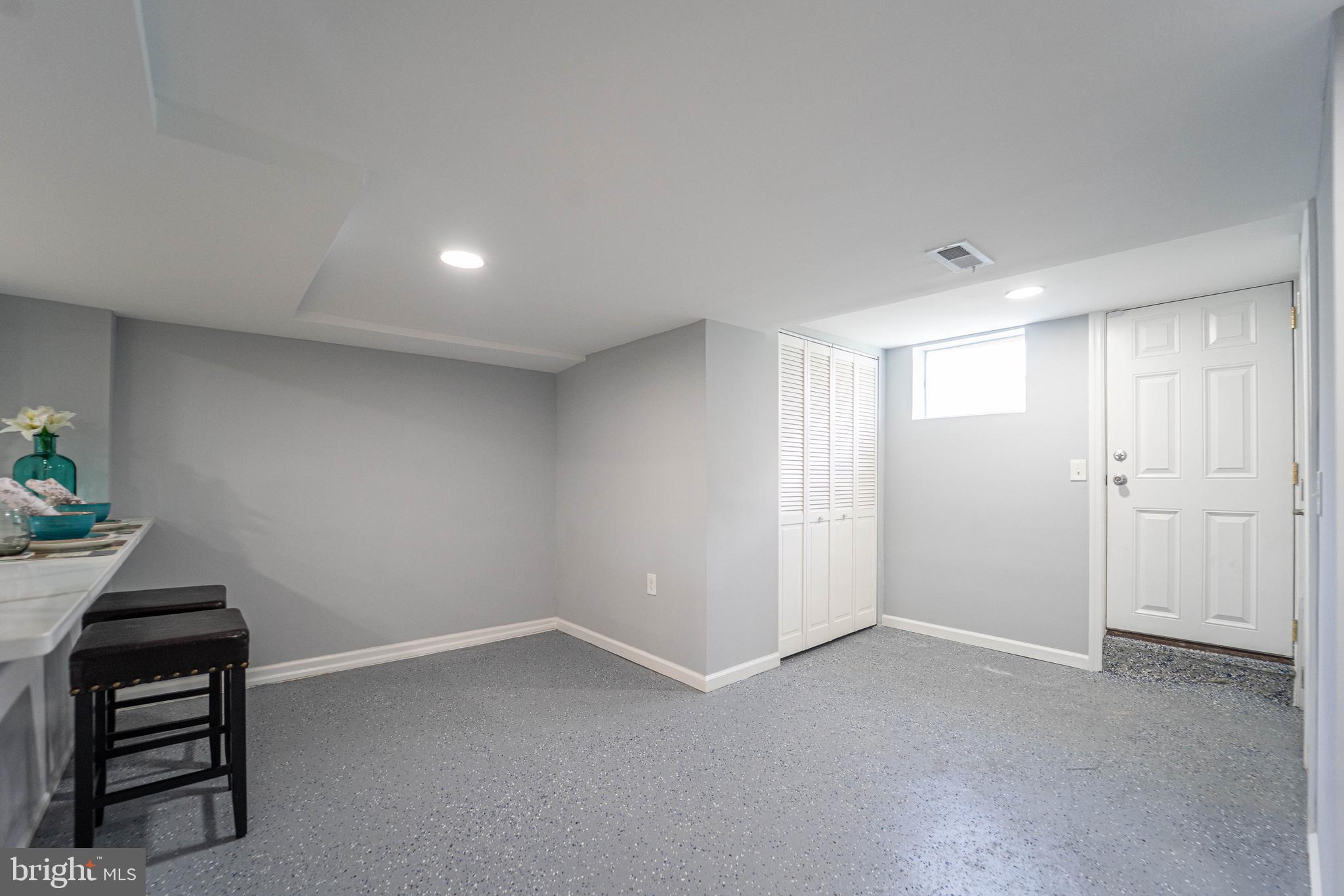 2841 Federal Street Baltimore, MD 21213 - Photo 19 of 39 a room with a bench and a chair