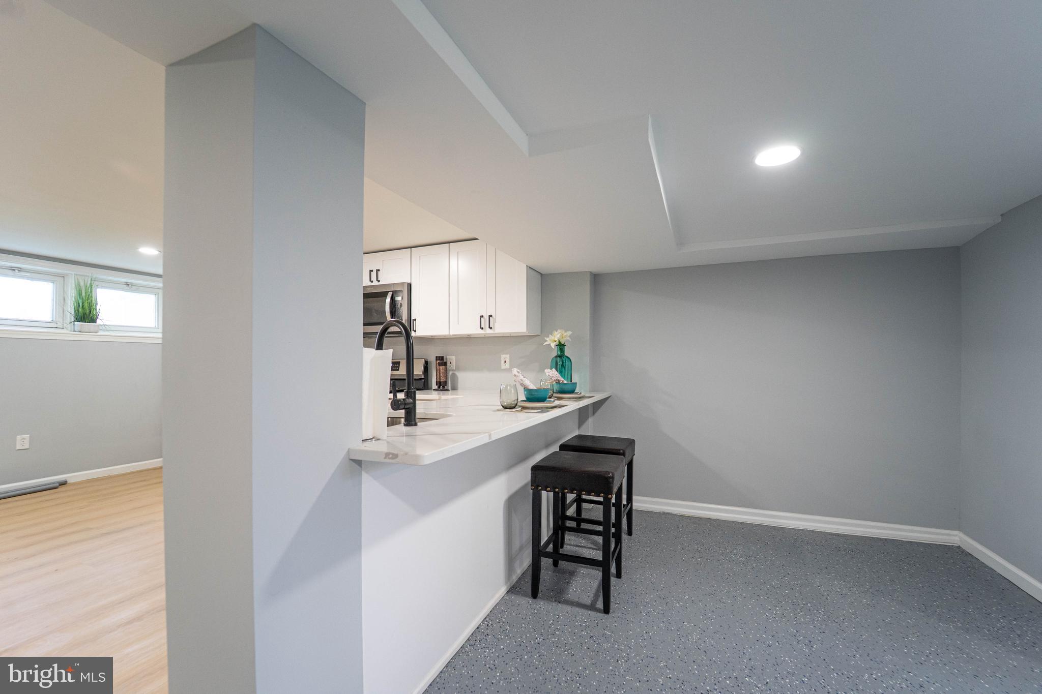 2841 Federal Street Baltimore, MD 21213 - Photo 20 of 39 a kitchen with a sink cabinets and appliances