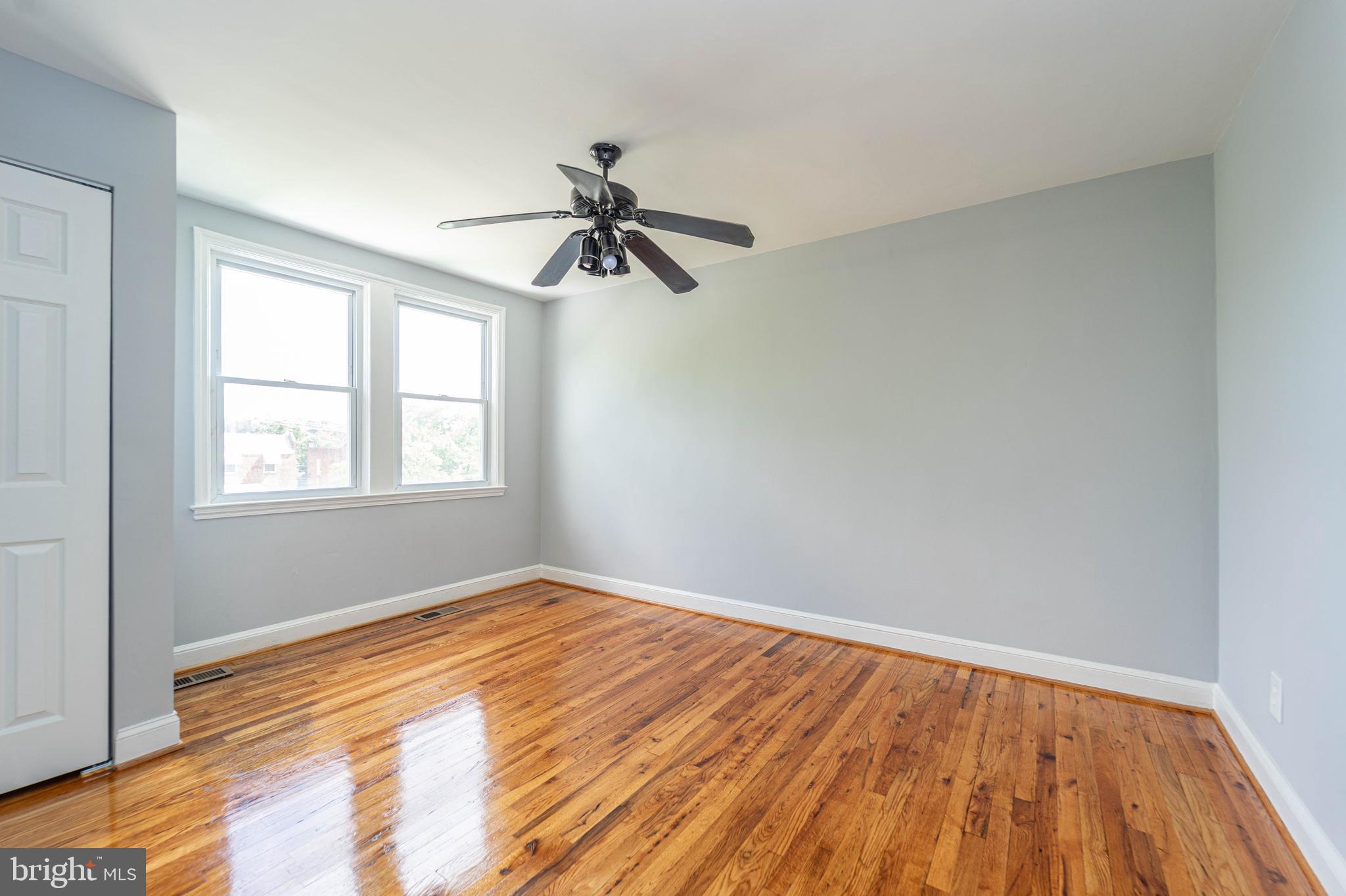 2841 Federal Street Baltimore, MD 21213 - Photo 25 of 39 a view of empty room with wooden floor and fan