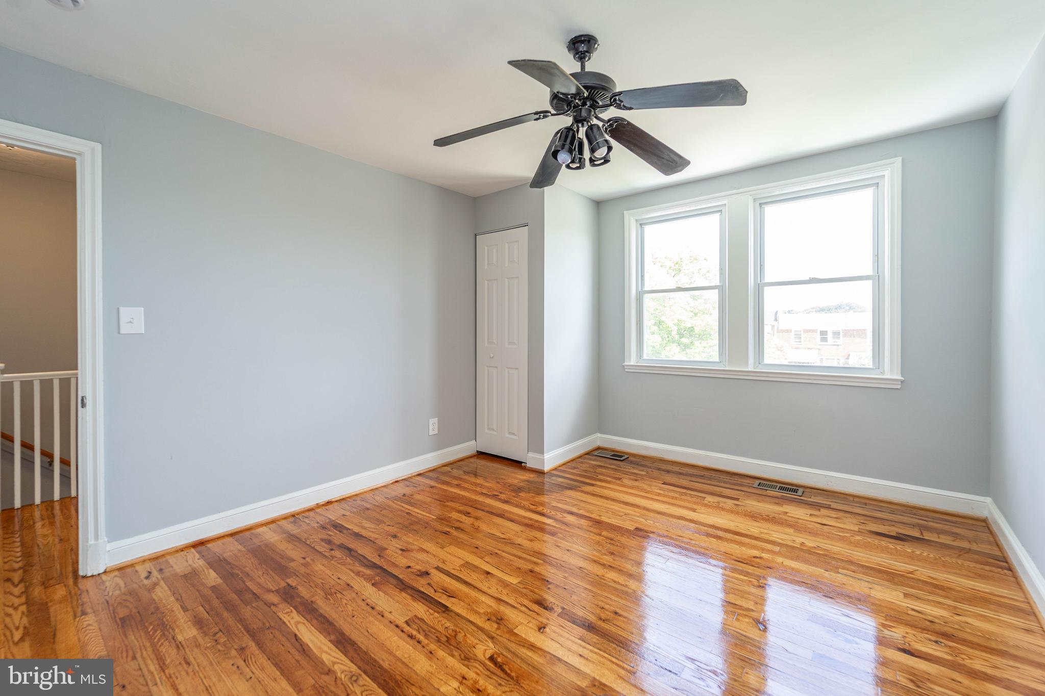2841 Federal Street Baltimore, MD 21213 - Photo 26 of 39 a view of empty room with wooden floor and fan