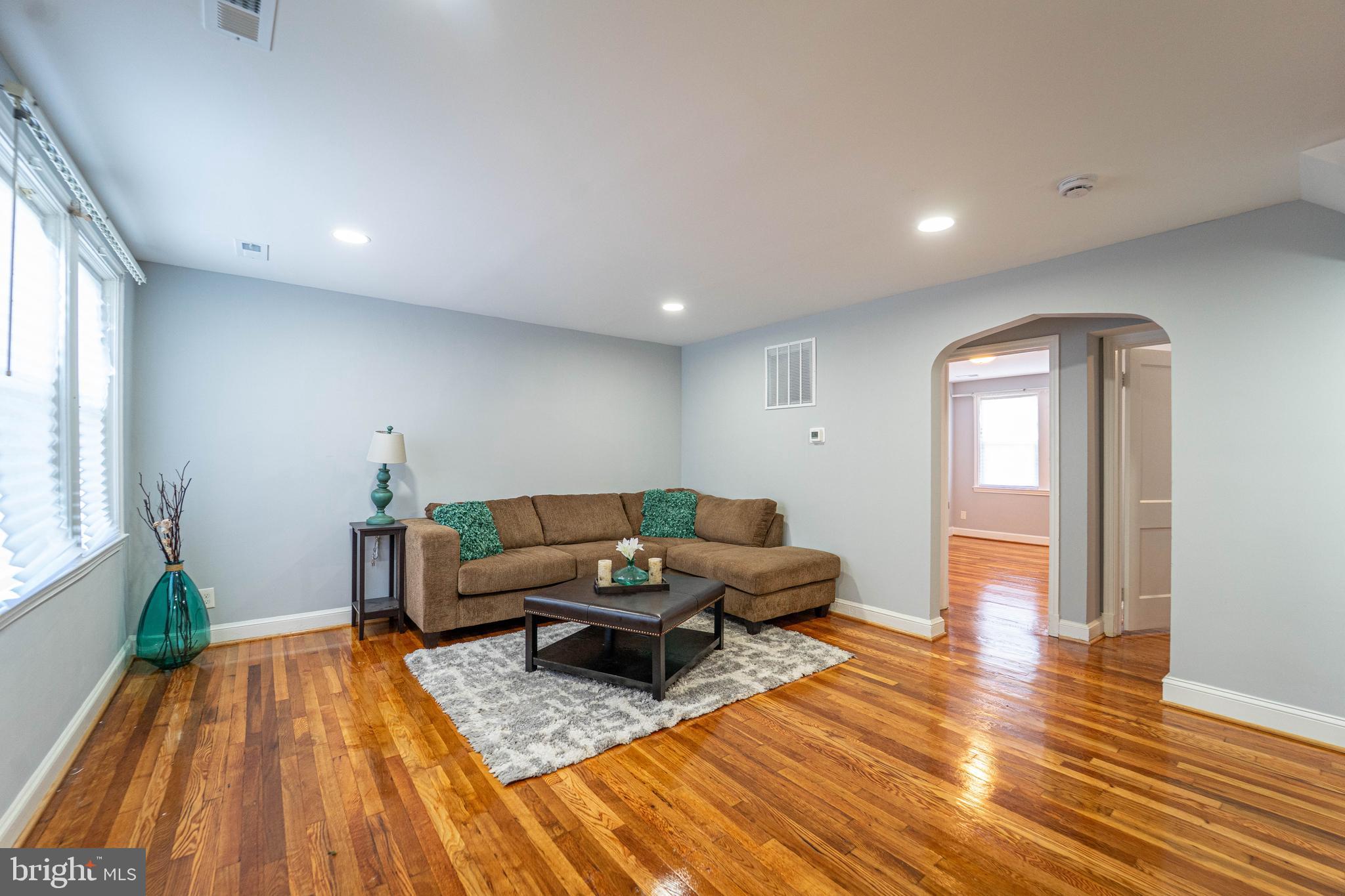 2841 Federal Street Baltimore, MD 21213 - Photo 3 of 39 a living room with furniture and a wooden floor