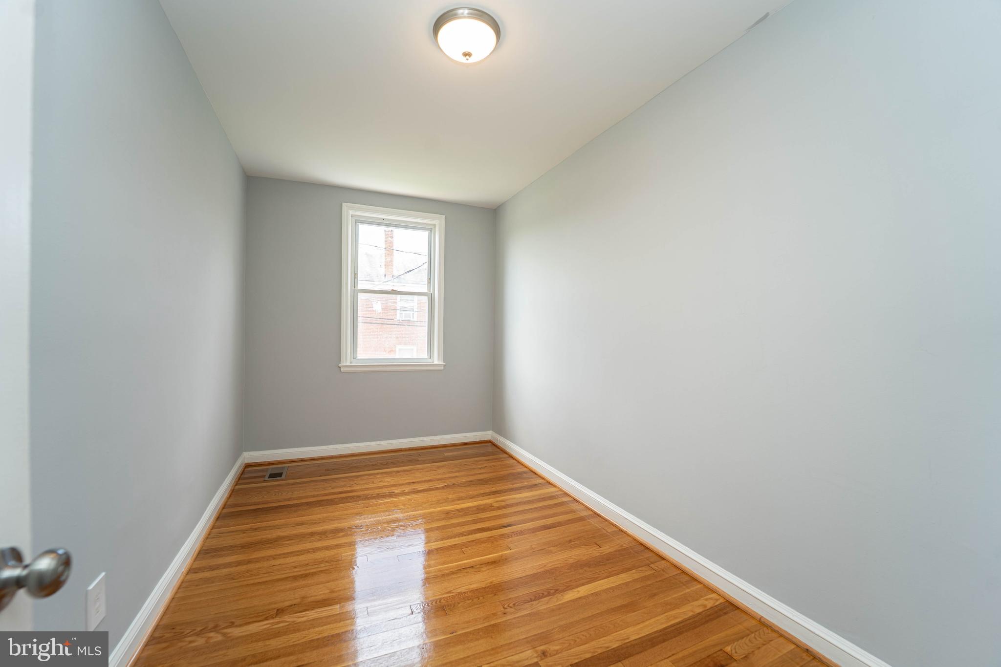 2841 Federal Street Baltimore, MD 21213 - Photo 34 of 39 a view of a room with wooden floor and window