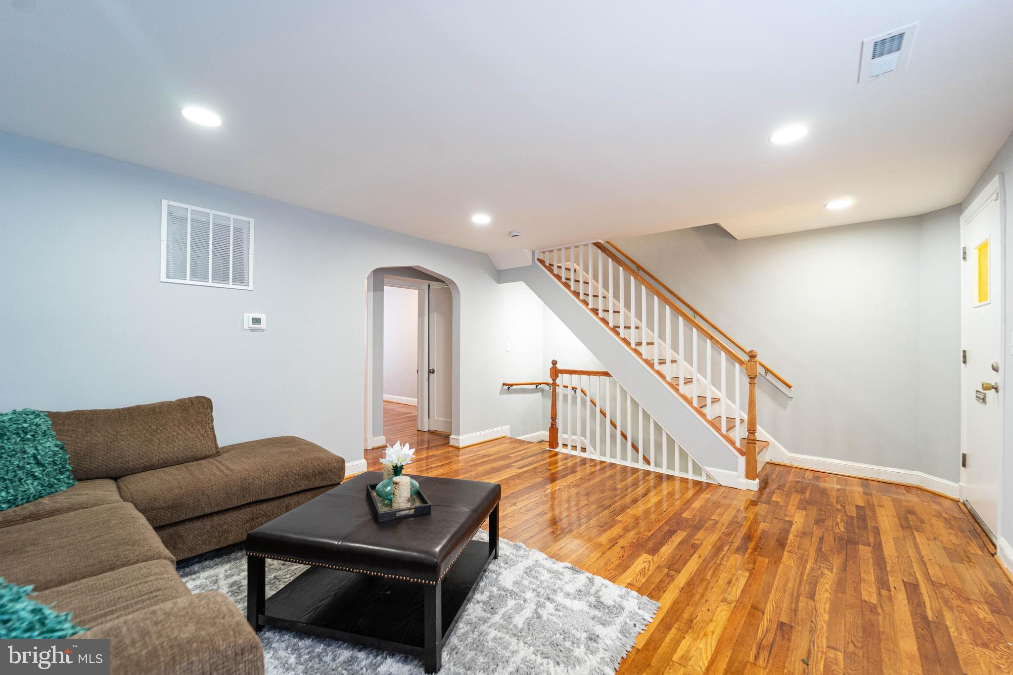 2841 Federal Street Baltimore, MD 21213 - Photo 4 of 39 a living room with furniture and a wooden floor