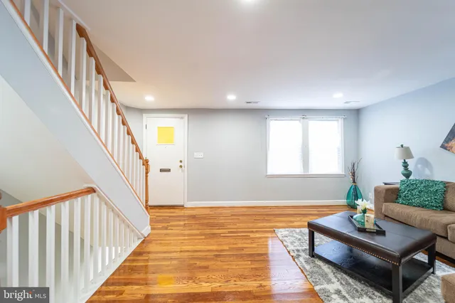 a living room with furniture and a rug
