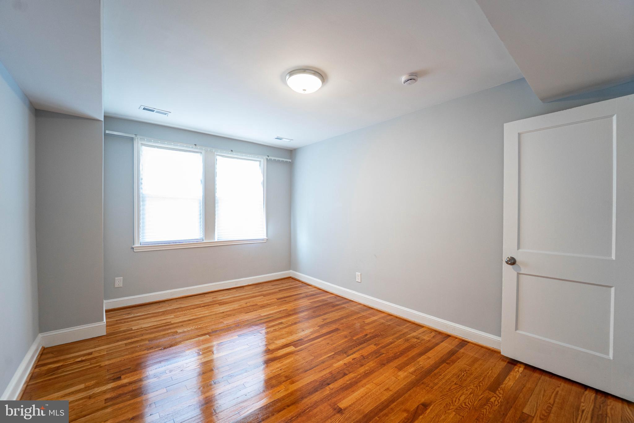 2841 Federal Street Baltimore, MD 21213 - Photo 8 of 39 a view of empty room with wooden floor and fan