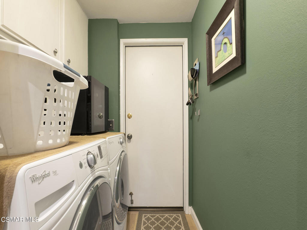 24829 Apple Street, Unit E Newhall, CA 91321 - Photo 16 of 29 a utility room with dryer and washer