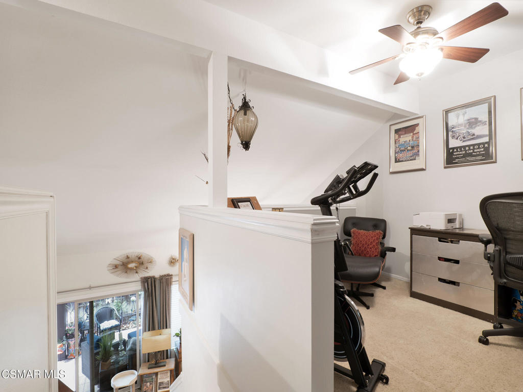 24829 Apple Street, Unit E Newhall, CA 91321 - Photo 18 of 29 a view of a workspace with furniture and a window