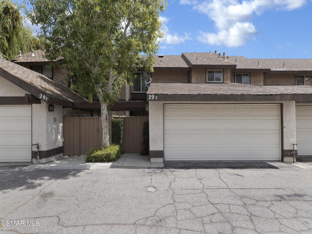 24829 Apple Street, Unit E Newhall, CA 91321 - Photo 2 of 29 a front view of a house
