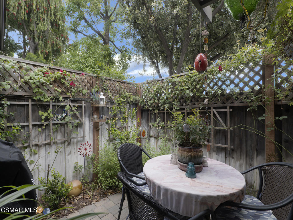 24829 Apple Street, Unit E Newhall, CA 91321 - Photo 24 of 29 a view of a chairs and table in the patio