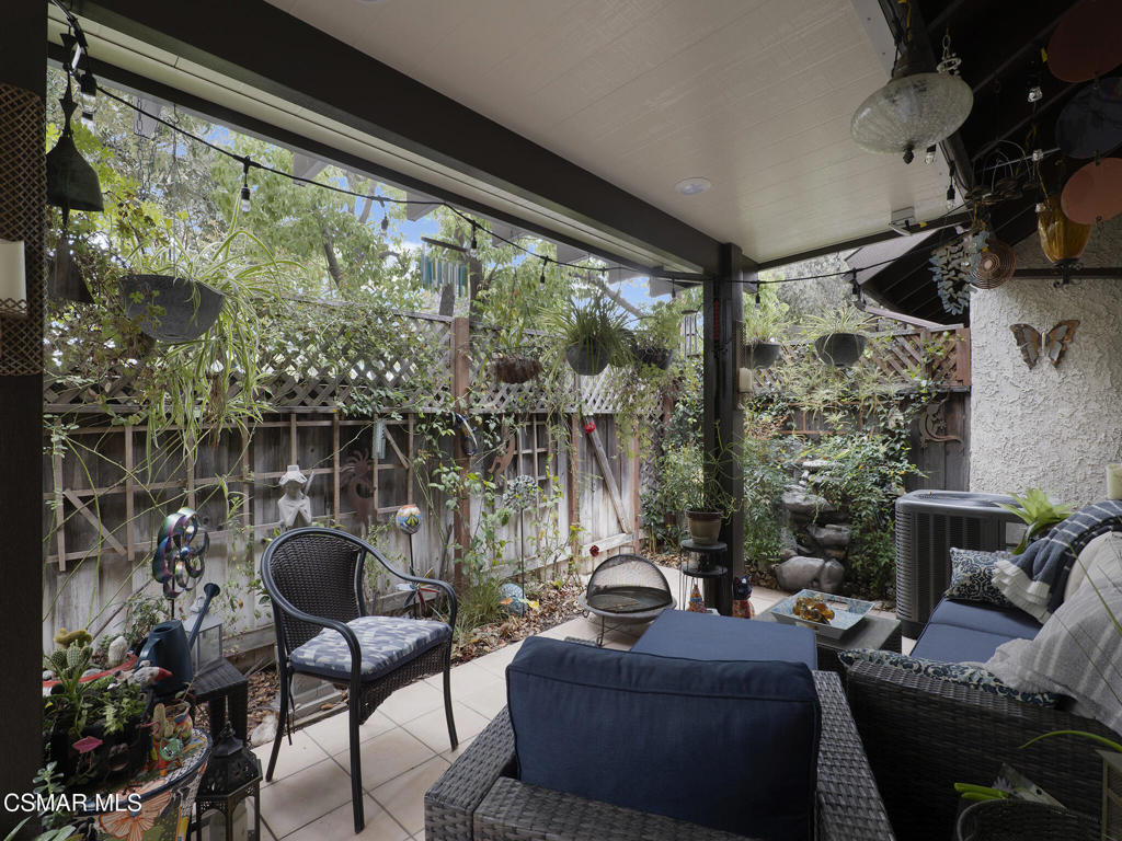 24829 Apple Street, Unit E Newhall, CA 91321 - Photo 26 of 29 a living room with furniture and a large window