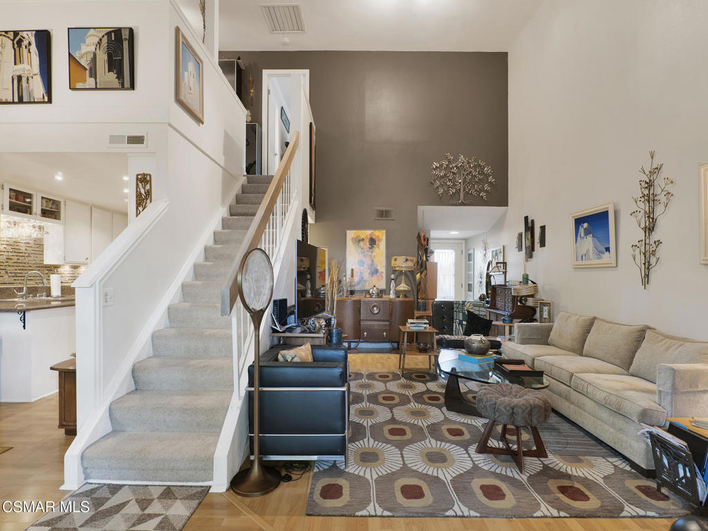 24829 Apple Street, Unit E Newhall, CA 91321 - Photo 4 of 29 a living room with furniture and a painting