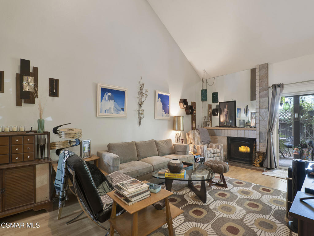 24829 Apple Street, Unit E Newhall, CA 91321 - Photo 5 of 29 a living room with furniture and a fireplace