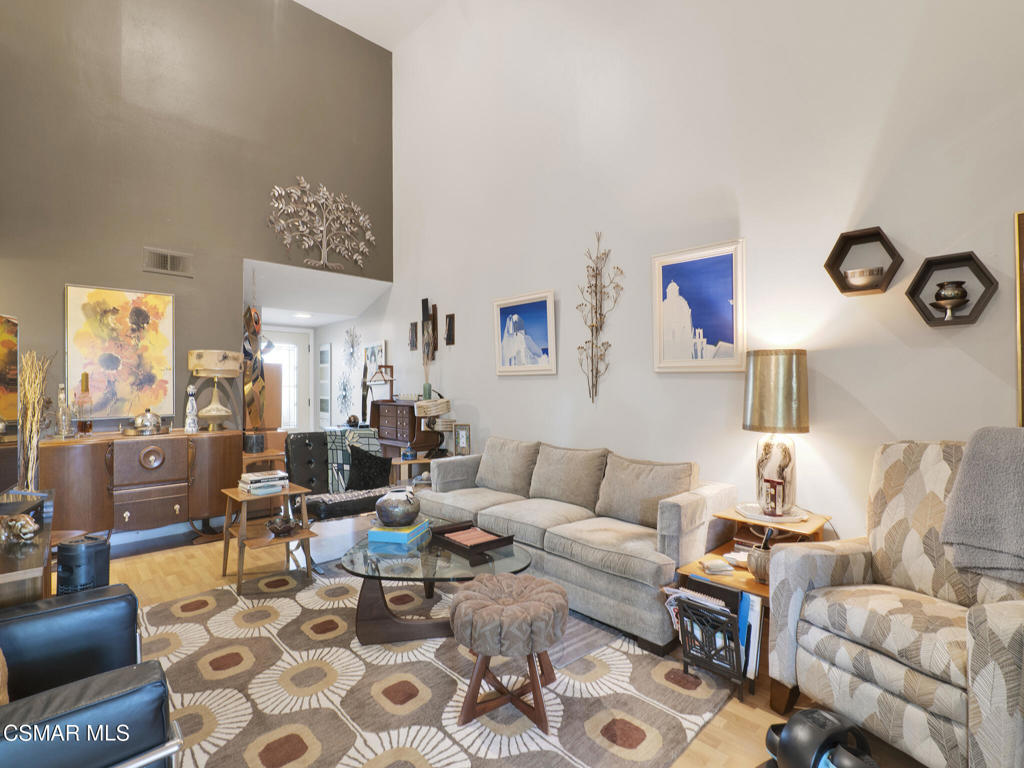 24829 Apple Street, Unit E Newhall, CA 91321 - Photo 7 of 29 a living room with furniture and wooden floor