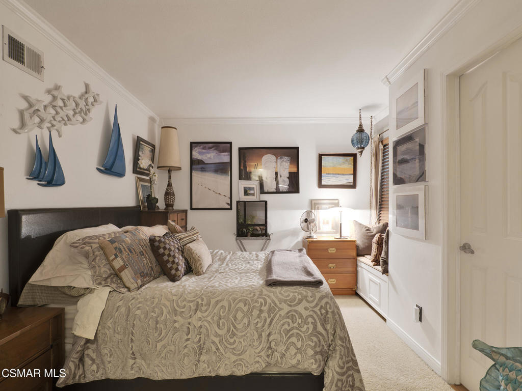 24829 Apple Street, Unit E Newhall, CA 91321 - Photo 9 of 29 a living room with furniture and a flat screen tv