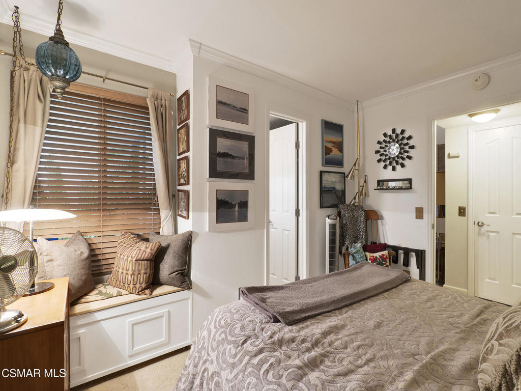 24829 Apple Street, Unit E Newhall, CA 91321 - Photo 10 of 29 a bedroom with a bed and a window