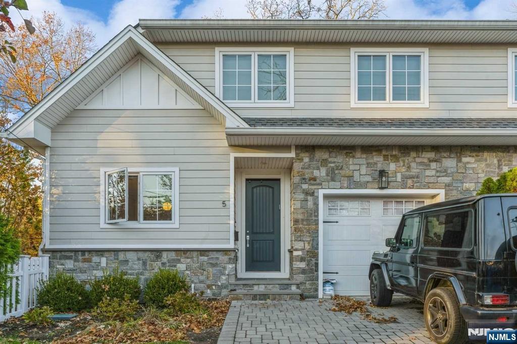 5 Benjamin Road Tenafly, NJ 07670 - Photo 1 of 50 a front view of a house with parking space