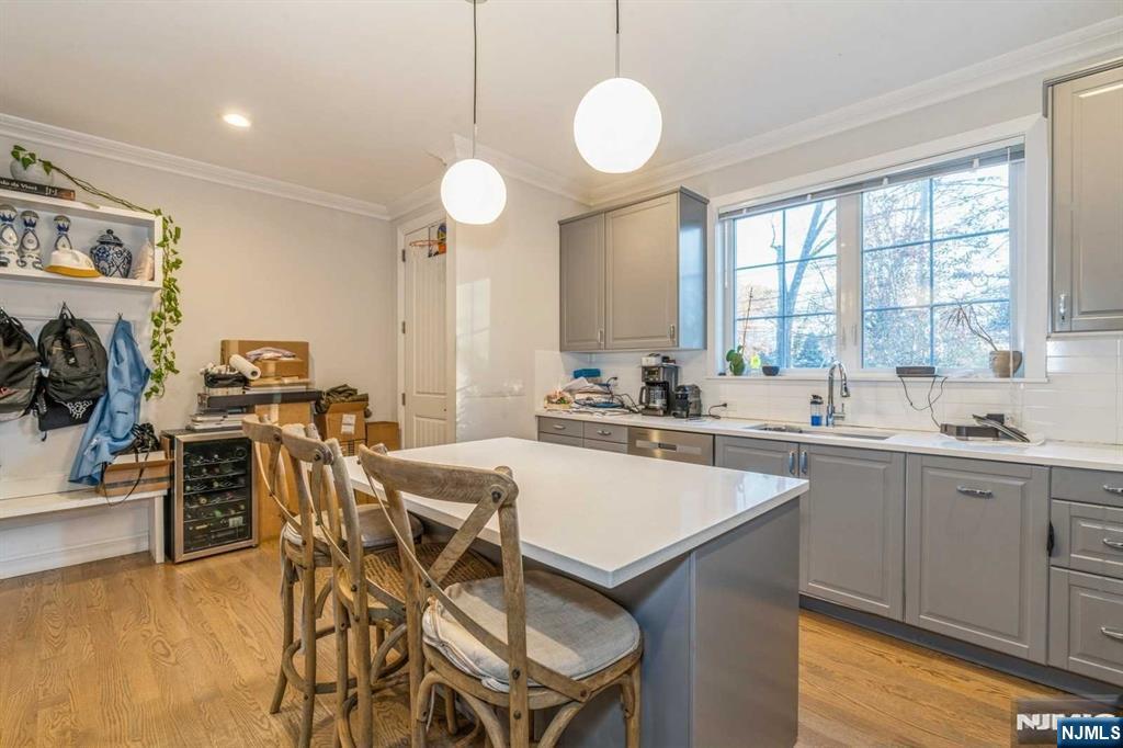 5 Benjamin Road Tenafly, NJ 07670 - Photo 13 of 50 a kitchen with a table chairs sink and cabinets