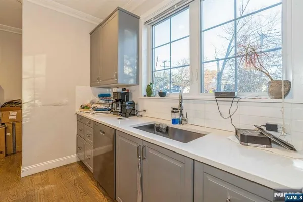 a kitchen with a sink and a window
