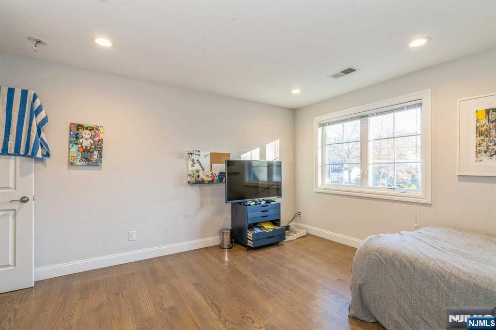 5 Benjamin Road Tenafly, NJ 07670 - Photo 20 of 50 a living room with furniture and a window