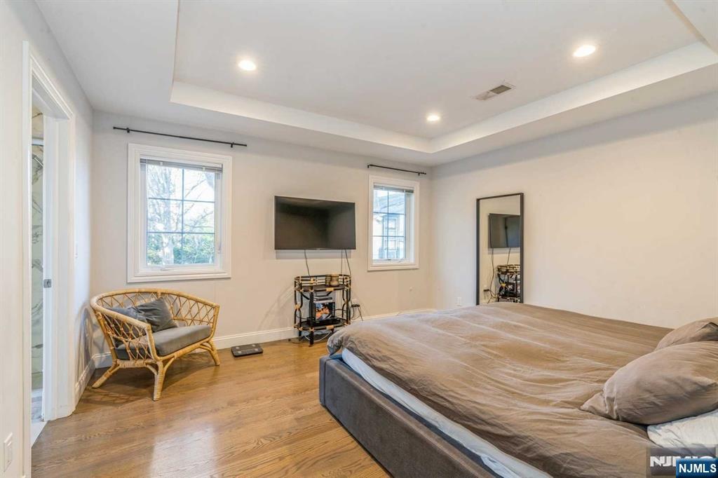 5 Benjamin Road Tenafly, NJ 07670 - Photo 29 of 50 a bedroom with a bed and a flat screen tv