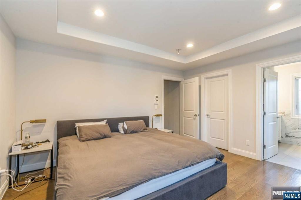 5 Benjamin Road Tenafly, NJ 07670 - Photo 30 of 50 a bedroom with a bed and wooden floor