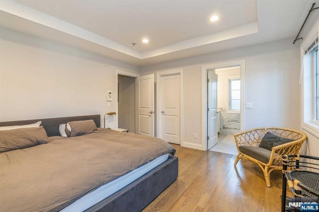 5 Benjamin Road Tenafly, NJ 07670 - Photo 31 of 50 a bedroom with a bed and wooden floor