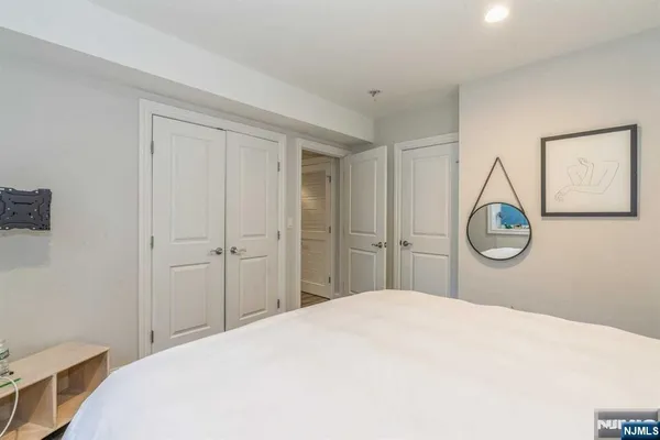 a bedroom with a bed and a closet
