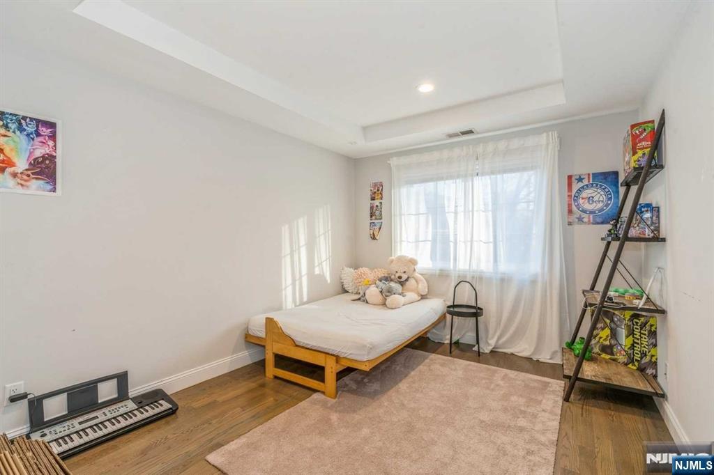 5 Benjamin Road Tenafly, NJ 07670 - Photo 36 of 50 a bedroom with furniture and a window