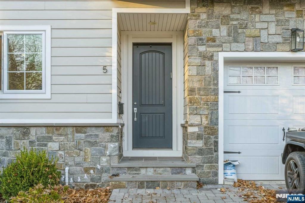 5 Benjamin Road Tenafly, NJ 07670 - Photo 45 of 50 a front view of a house with a door
