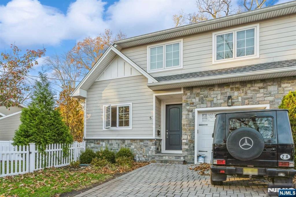 5 Benjamin Road Tenafly, NJ 07670 - Photo 46 of 50 a sign that is on the side of a brick house