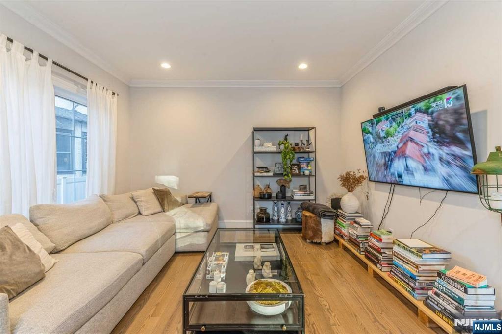5 Benjamin Road Tenafly, NJ 07670 - Photo 5 of 50 a living room with furniture and a flat screen tv