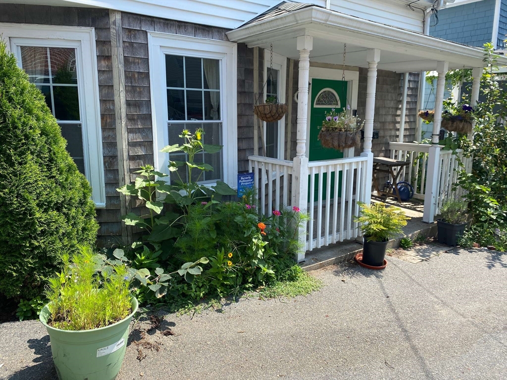 8 May Street Beverly, MA 01915 - Photo 2 of 25 a view of a chair and table in the patio in front of house