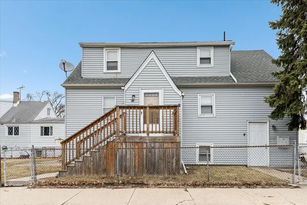 a front view of a house with a garage
