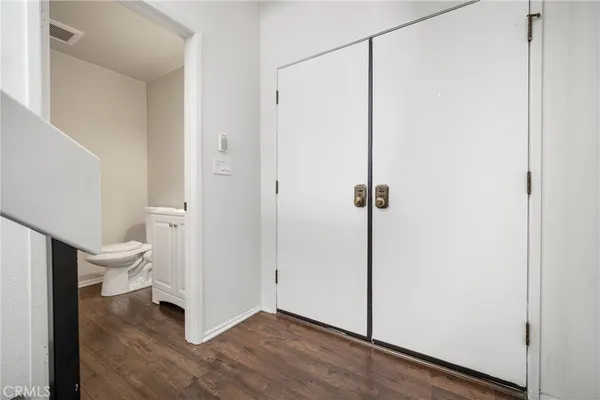 a view of a bathroom with a granite countertop toilet