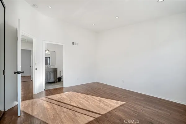 a bedroom with a bed and a view of bathroom