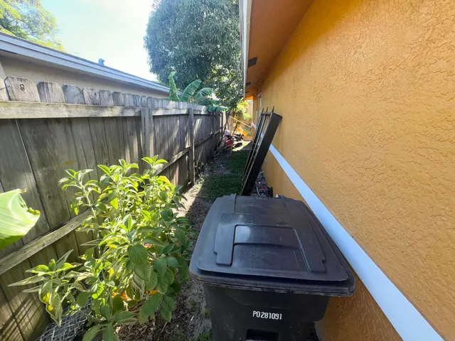 a view of a backyard with chairs