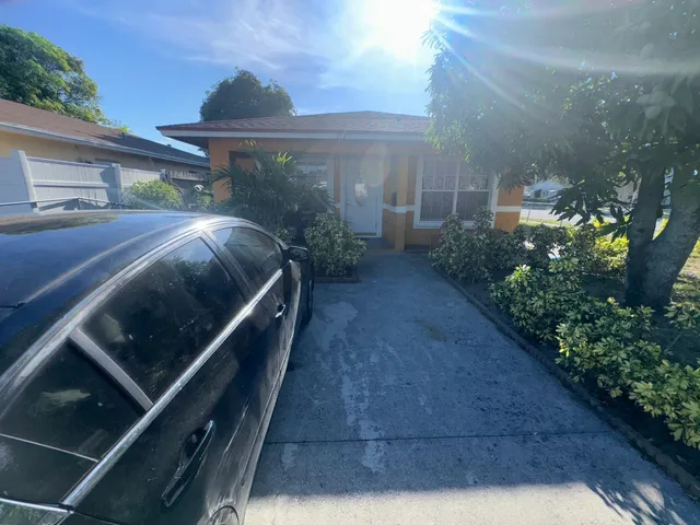 a view of backyard with patio