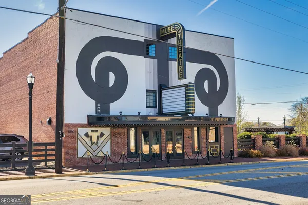 a front view of a house with a swimming pool