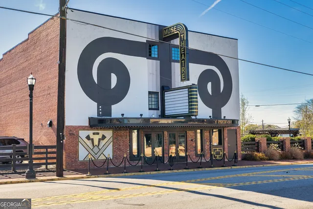 a front view of a house with a swimming pool