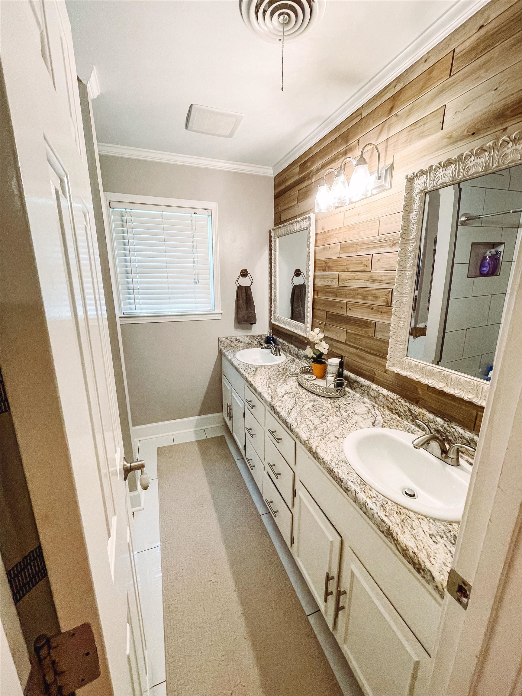 328 Rutledge Street Collierville, TN 38017 - Photo 11 of 19 a bathroom with a granite countertop sink a mirror and a bathtub