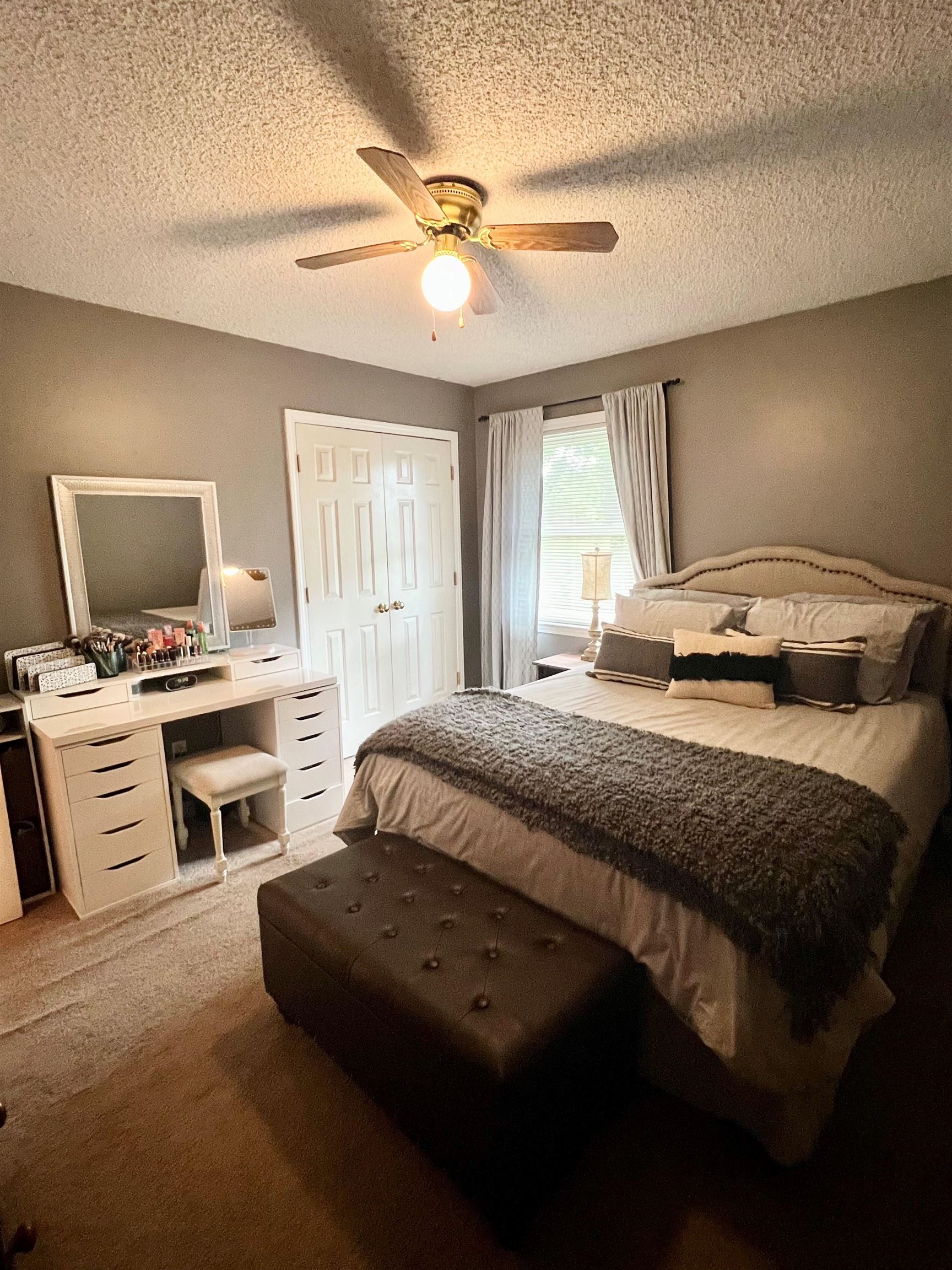 328 Rutledge Street Collierville, TN 38017 - Photo 15 of 19 a bedroom with a bed and a flat screen tv