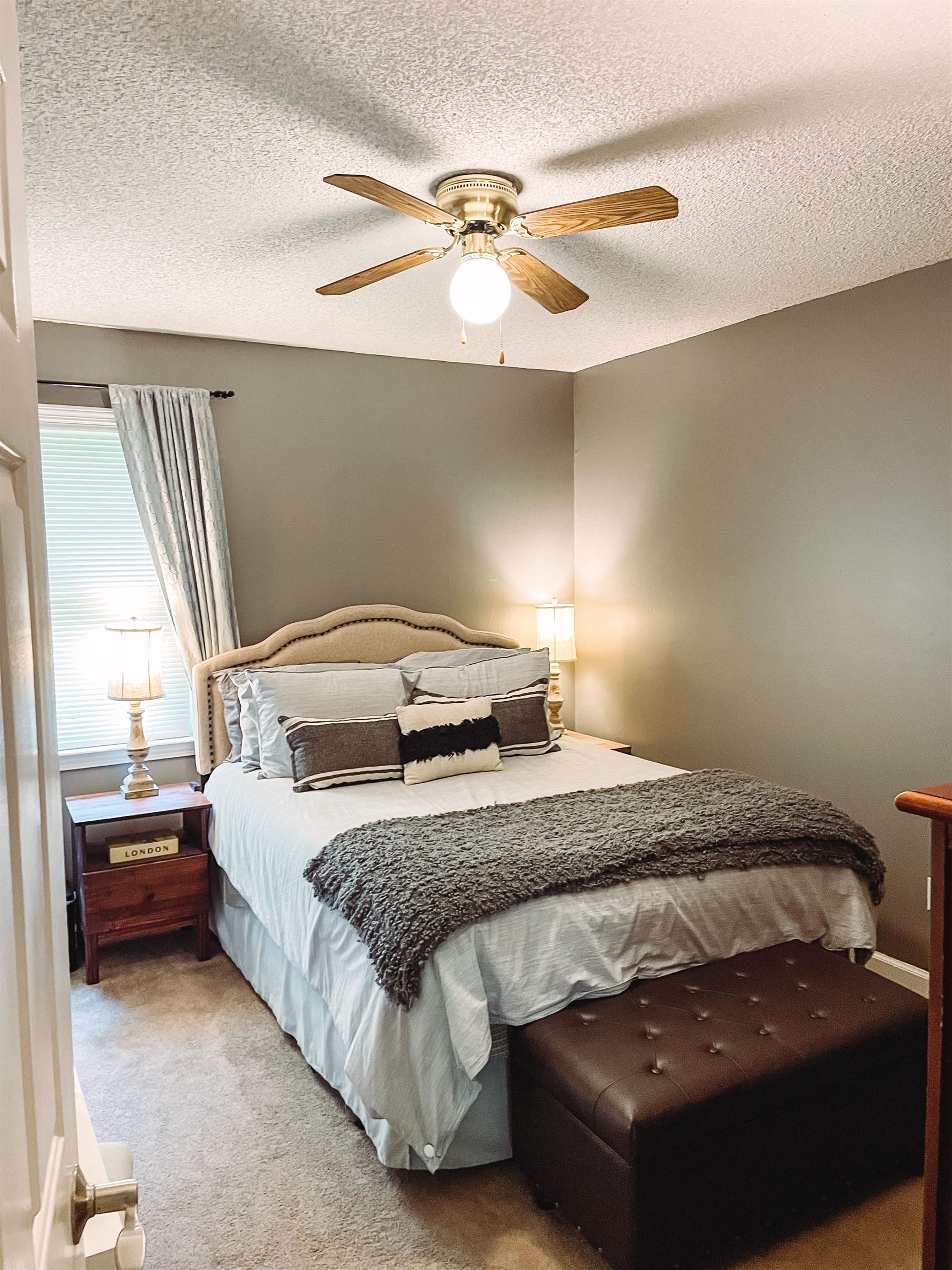 328 Rutledge Street Collierville, TN 38017 - Photo 8 of 19 a bedroom with a bed and a ceiling fan