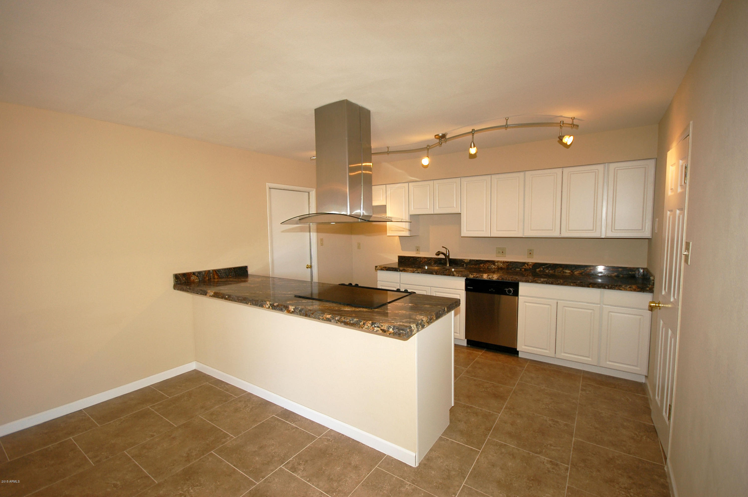 3151 West Redfield Road Phoenix, AZ 85053 - Photo 2 of 15 a kitchen with a sink a stove and cabinets