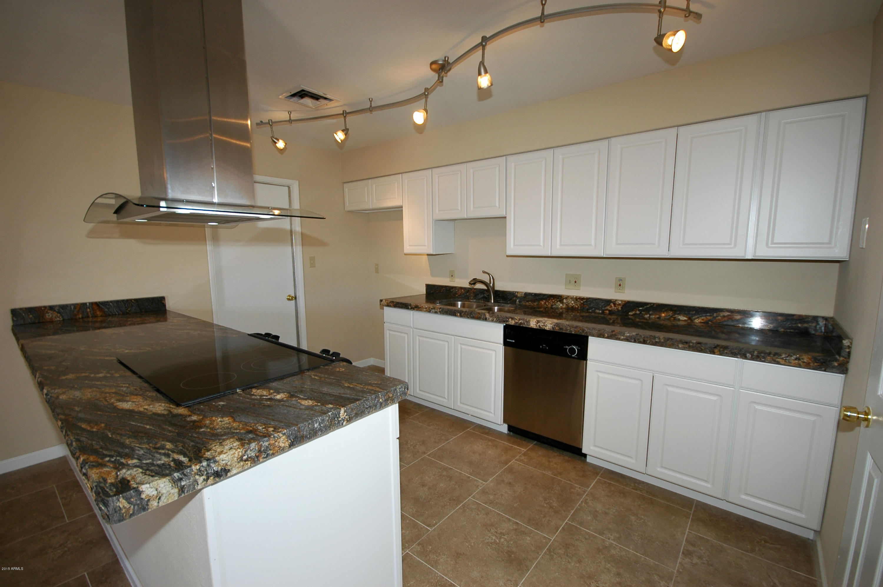 3151 West Redfield Road Phoenix, AZ 85053 - Photo 3 of 15 a kitchen with a sink and cabinets