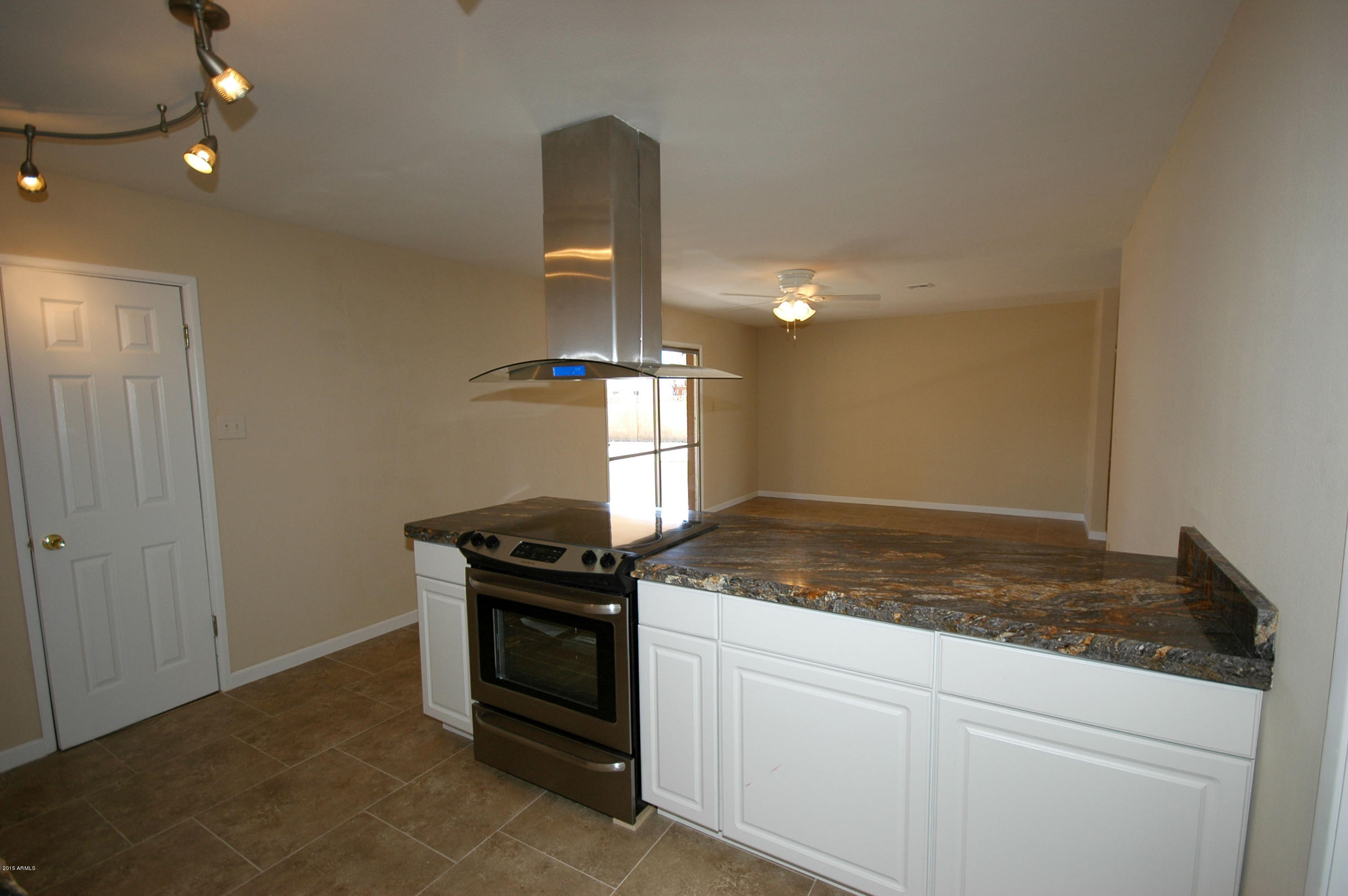 3151 West Redfield Road Phoenix, AZ 85053 - Photo 4 of 15 a kitchen with a stove and a sink