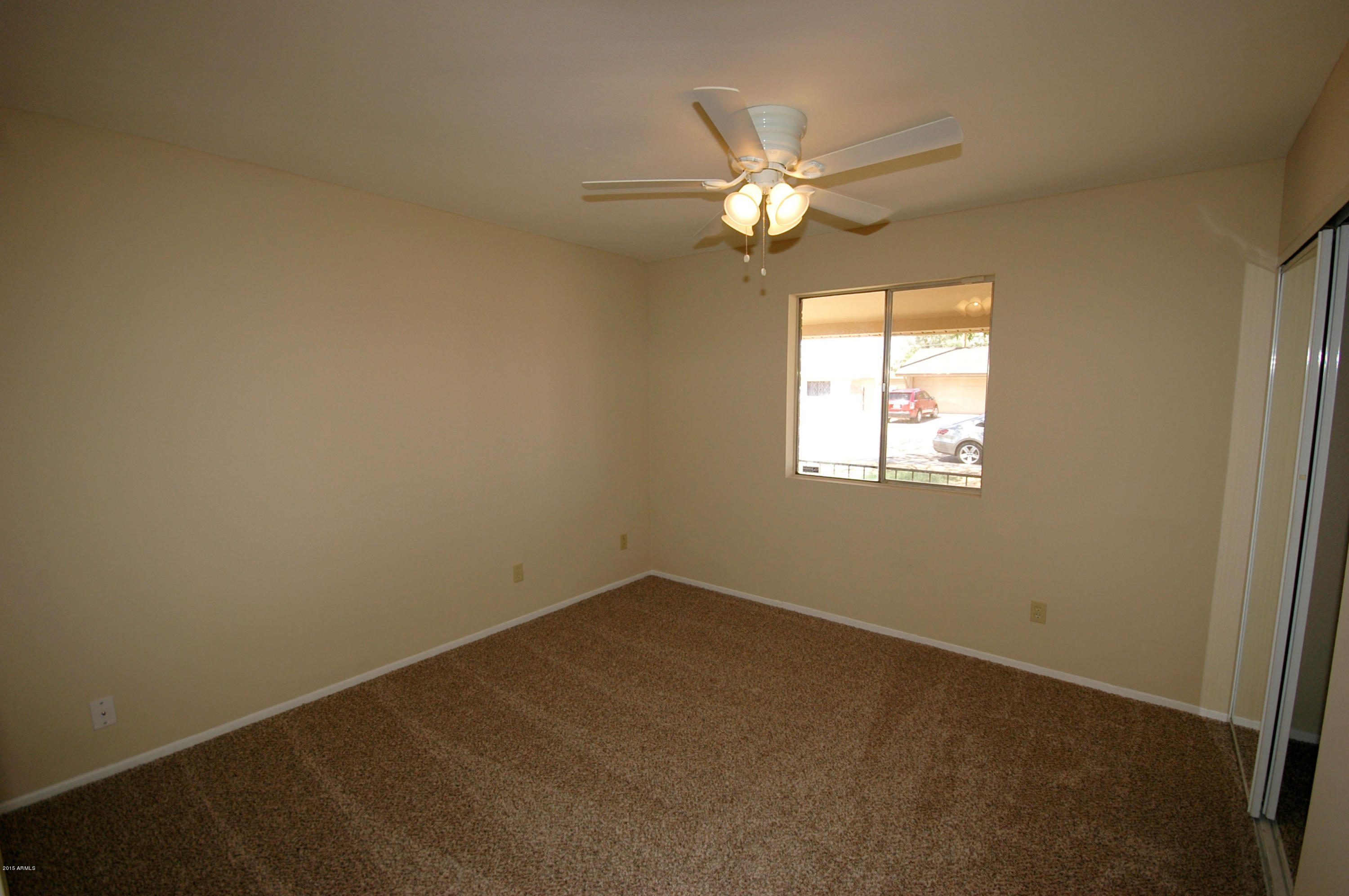 3151 West Redfield Road Phoenix, AZ 85053 - Photo 8 of 15 a view of an empty room with a window