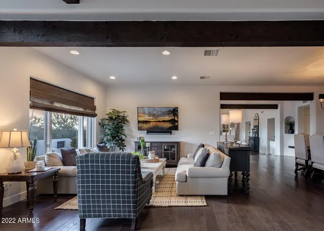 a kitchen with stainless steel appliances kitchen island granite countertop a stove a sink and a refrigerator