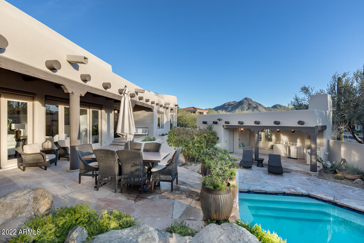 10801 East Happy Valley Road, Unit 74 Scottsdale, AZ 85255 - Photo 19 of 27 a roof deck with table and chairs potted plants