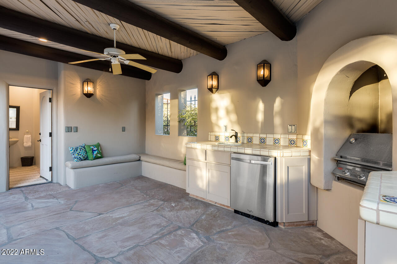 10801 East Happy Valley Road, Unit 74 Scottsdale, AZ 85255 - Photo 20 of 27 a view of a kitchen with a sink and a refrigerator